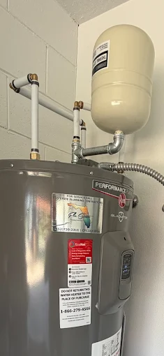 Newly installed water heater with expansion tank and copper connections