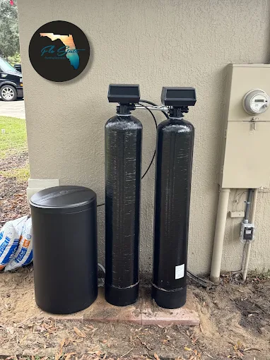 Water softener and filtration tanks installed outside a home