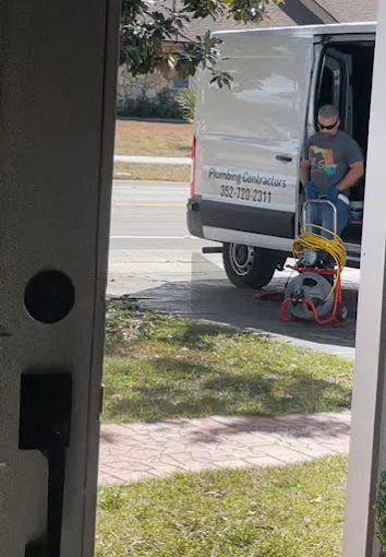 Flo State van with a drain machine on a service call